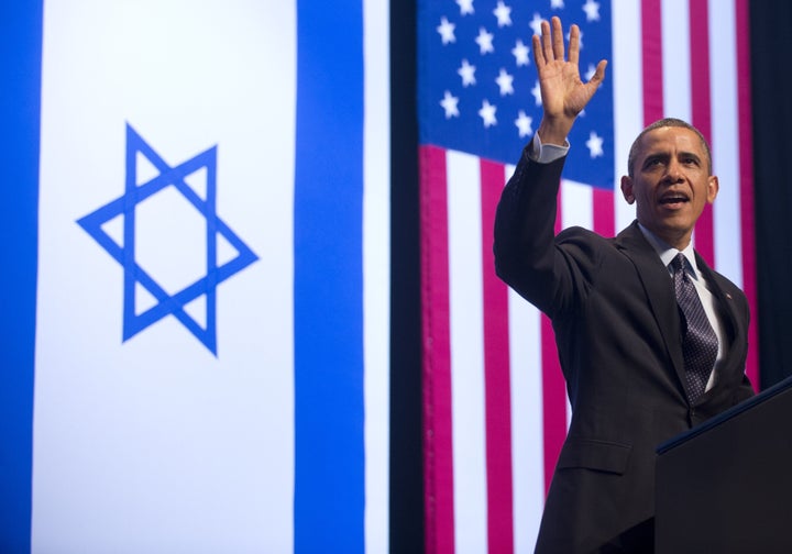 US President Barack Obama waves as he arrives to speak on US, Israel and Mideast relations at the Jerusalem Convention Center