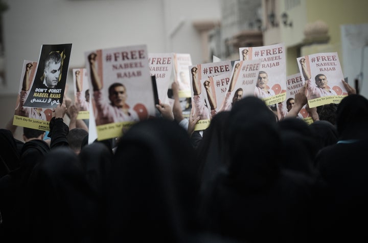 Bahraini protesters hold up placards featuring jailed human rights activist, Nabeel Rajab during a rally to support him on March 23, 2013 in the village of Saar, West of Manama. The International Federation for Human Rights said on March 22 that around 80 people have been killed in Bahrain since violence first broke out on February 14, 2011 when thousands of protesters camped out in Manama's Pearl Square, taking their cue from the Arab Spring uprisings. AFP PHOTO/MOHAMMED AL-SHAIKH (Photo credit should read MOHAMMED AL-SHAIKH/AFP/Getty Images)