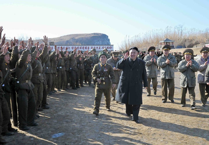 ---EDITORS NOTE--- RESTRICTED TO EDITORIAL USE - MANDATORY CREDIT 'AFP PHOTO / KCNA VIA KNS' - NO MARKETING NO ADVERTISING CAMPAIGNS - DISTRIBUTED AS A SERVICE TO CLIENTS This undated picture taken by North Korea's official Korean Central News Agency on March 11, 2013 shows North Korean leader Kim Jong Un (C) inspecting the Wolnae Islet Defence Detachment in North Korea's western sector near the disputed maritime frontier with South Korea . AFP PHOTO / KCNA via KNS (Photo credit should read KNS/AFP/Getty Images)