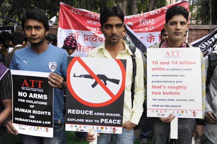 Indian activists of non-governmental organisations (NGOs) hold placards during a peace march in New Delhi on February 15, 2010, The demonstrators demanded the regulatation of transfer of conventional weapons and expressed support for the 2006 United Nations decision to begin drafting an Arms Trade Treaty, aimed to promote responsible transfers of weapons globally to prevent human rights violations. AFP PHOTO/ Manpreet ROMANA (Photo credit should read MANPREET ROMANA/AFP/Getty Images)
