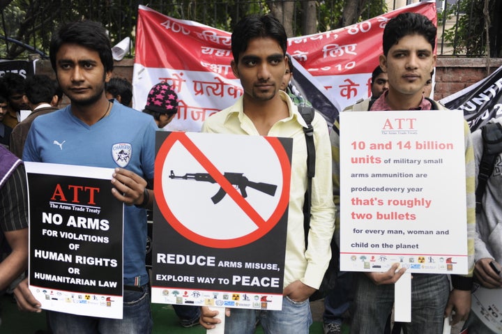 Indian activists of non-governmental organisations (NGOs) hold placards during a peace march in New Delhi on February 15, 201