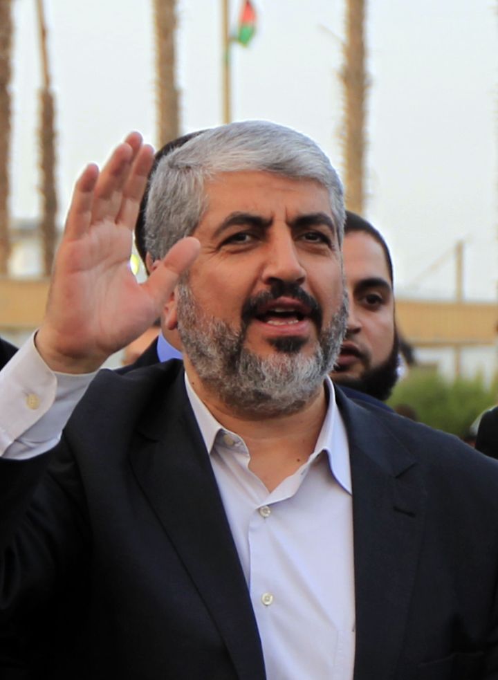 Hamas leader in exile Khaled Meshaal waves goodbye upon his departure from the Gaza Strip on December 10, 2012 in Rafah, on the border with Egypt. Exiled Hamas chief Khaled Meshaal left Gaza after a historic first visit to the tiny Palestinian enclave. AFP PHOTO/ SAID KHATIB (Photo credit should read SAID KHATIB/AFP/Getty Images)