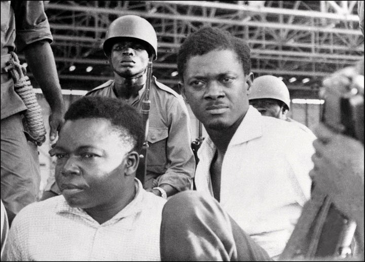 Soldiers guard Patrice Lumumba (R), Prime Minister of then Congo-Kinshasa, and Joseph Okito (L), vice-president of the Senate