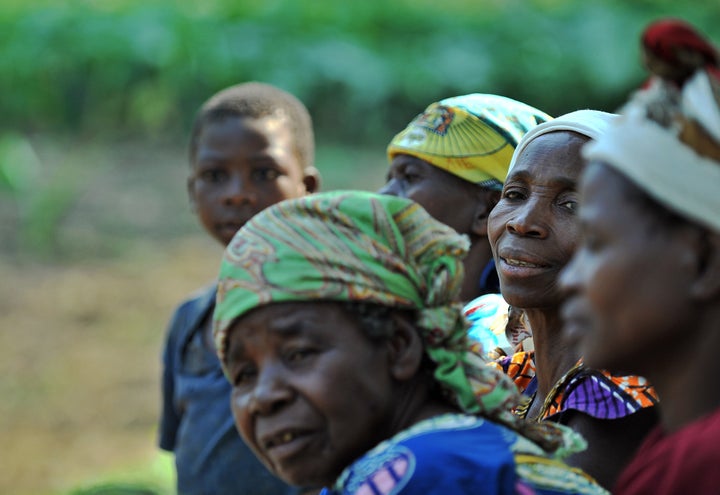 TO GO WITH AFP STORY BY EMMANUEL PEUCHOT Photo made July 02, 2011 shows women waiting at a medical centre at Kanguli village