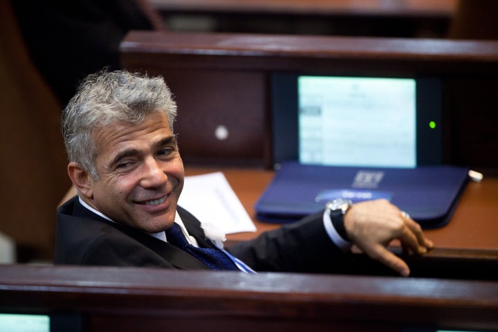 JERUSALEM, ISRAEL - FEBRUARY 05: Yair Lapid leader of the Israeli Yesh Atid party attends the swearing-in ceremony of the 19th Knesset, the new Israeli parliament, on February 5, 2013 in Jerusalem, Israel. The 120 members included a record 48 new law makers. (Photo by Uriel Sinai/Getty Images)