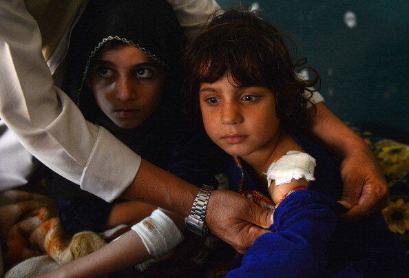 A Pakistani victim of US drone attack rests on a bed after she arrived with her brothers and sisters from the North Waziristan area of Ghundai Village for treatment in Peshawar on November 3, 2012, after US missile hit near their house on October 24. A US drone fired two missiles at a suspected militant compound in northwest Pakistan, killing three people, security officials said. AFP PHOTO/ A MAJEED (Photo credit should read A Majeed/AFP/Getty Images)