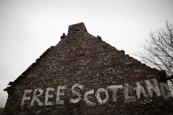 GREENLOANING, SCOTLAND - JANUARY 10: Graffiti stating 'Free Scotland' is written on the gable end wall of a derelict cottage