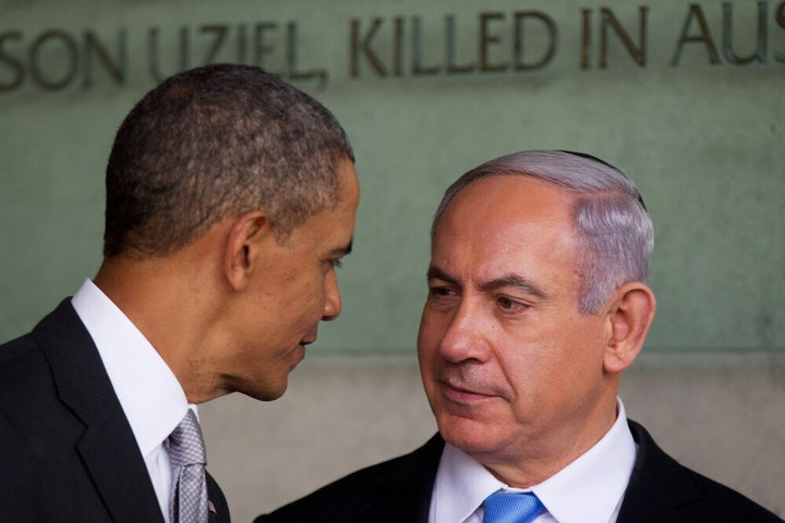 JERUSALEM, ISRAEL - MARCH 22: (ISRAEL OUT) U.S. President Barack Obama speaks with Israeli Prime Minister Benjamin Netanyahu during his visit to the Yad Vashem Holocaust Memorial museum on March 22, 2013 in Jerusalem, Israel. This is Obama's first visit as president to the region and his itinerary includes meetings with the Palestinian and Israeli leaders as well as a visit to the Church of the Nativity in Bethlehem. (Photo by Uriel Sinai/Getty Images)