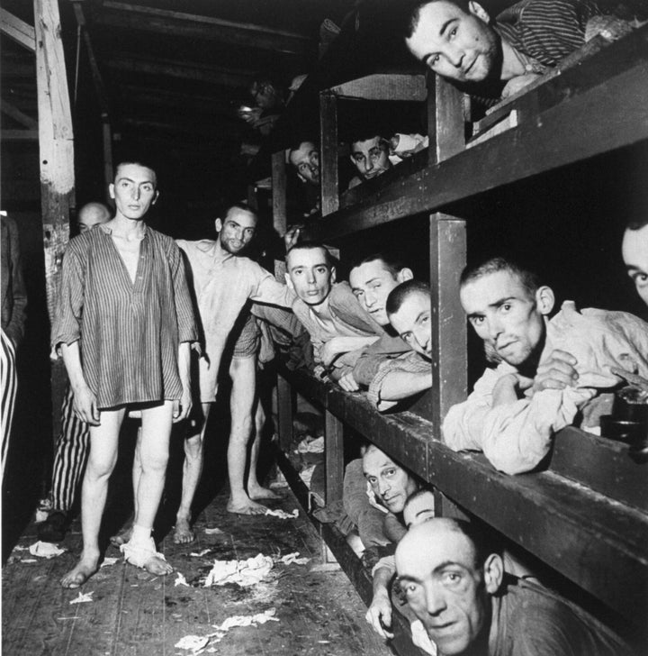 Emaciated male prisoners lying in bunks & standing half-naked at Buchenwald concentration camp during liberation by American forces. (Photo by Margaret Bourke-White//Time Life Pictures/Getty Images)