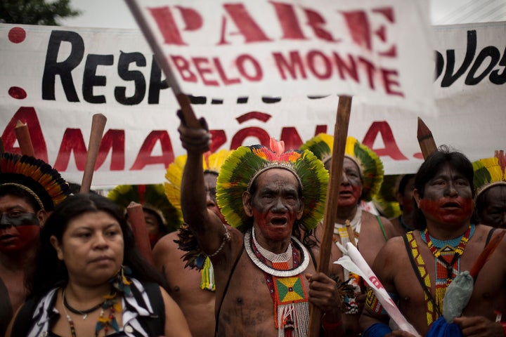 RIO DE JANEIRO, BRAZIL - JUNE 20: Brazilian indigenous, during an indigenous march against the hydroelectric of Belo Monte in the surroundings of RioCentro convention center, where the UN Conference on Sustainable Development is being , on June 20, 2012 in Rio de Janeiro, Brazil. (Photo by Buda Mendes/LatinContent/Getty Images)