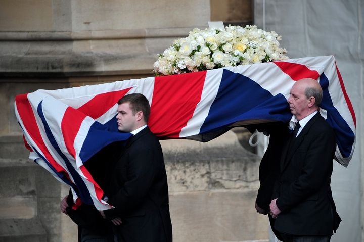 Pallbearers carry the coffin of former British prime minister Margaret Thatcher as it arrives to the Crypt Chapel of St Mary Undercoft at the Houses of Parliament in London on April 16, 2013, to allow lawmakers to pay their last respects to the iron lady on the eve of her ceremonial funeral. As Thatcher requested when she planned her own funeral, her body will remain overnight in a chapel at the Palace of Westminster in central London, where she served for more than half a century in both the lower and upper houses. AFP PHOTO/CARL COURT (Photo credit should read CARL COURT/AFP/Getty Images)