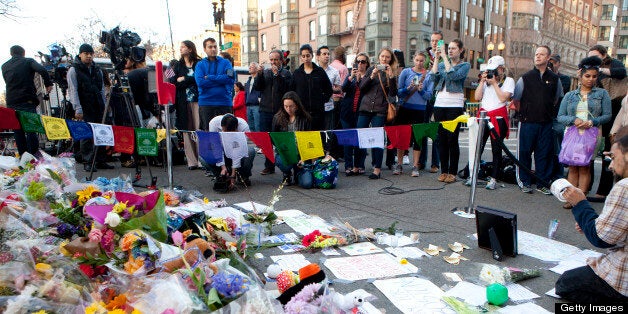 BOSTON, MA - APRIL 17: Two days after the tragedy, a makeshift memorial is growing on Boylston Street at a roadblock near the