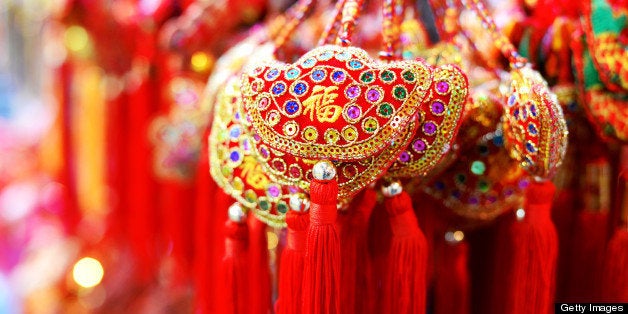 The color Red is a symbol of celebration in Chinese tradition. It is commonly seen at festive seasons, weddings, baby shower, house-warming parties as well opening of new businesses. Every ornaments has its own meaning - in this image the word FU is embroiled on to the shape of a traditional Chinese gold nugget.