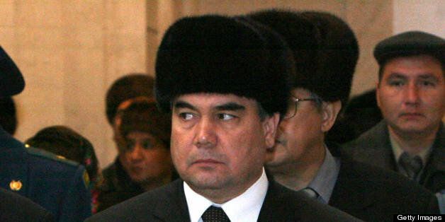 ASHGABAT, TURKMENISTAN: Recent picture taken 24 December shows Turkmenistan's Acting President Kurbanguly Berdymukhamedov standing near the coffin of late President Saparmurat Niyazov during his burial in Ashgabat. A special assembly in Turkmenistan 26 December 2006 tapped interim leader Gurbanguly Berdymukhammedov as frontrunner in the process to replace the Central Asian country's deceased strongman president, Saparmurat Niyazov. The specially convened People's Council selected six candidates to run on February 11, but the clear favourite was Berdymukhammedov, the first deputy prime minister and caretaker president. AFP PHOTO / POOL / ANDRIY MOSIENKO (Photo credit should read ANDRIY MOSIENKO/AFP/Getty Images)