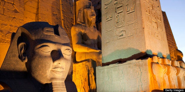 Ancient monuments stand illuminated in the evening at the Temple of Luxor in Luxor, Egypt, on Wednesday, April 24, 2013. Egypt ranked last in terms of security and safety on the World Economic Forum's 2013 Travel and Tourism Competitiveness Index. Photographer: Shawn Baldwin/Bloomberg via Getty Images