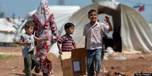 Internally displaced Syrian families spend their day at the Maiber al-Salam refugee camp along the Turkish border in the nort
