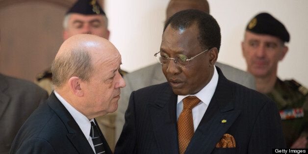 France's Defence Minister Jean-Yves Le Drian (L) speaks with Chad's President Idriss Deby after their meeting at the presidential palace in N'Djamena on April 27, 2013. Chad should remain militarily involved in Mali, Le Drian said Saturday in N'Djamena on a tour of the region to drum up support for a robust force when his own troops pull out. Mali called on France's help in January to halt an Islamist advance on Bamako and French and African troops have since pushed the Al-Qaeda-linked militants into desert and mountain hideouts, from where they are staging guerrilla attacks. AFP PHOTO / MARTIN BUREAU (Photo credit should read MARTIN BUREAU/AFP/Getty Images)