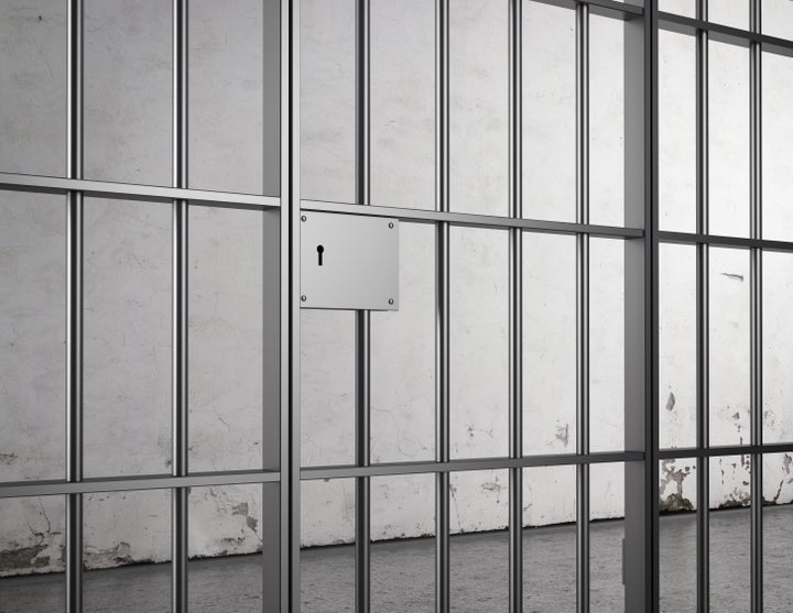 a closeup of a jail door with a ...