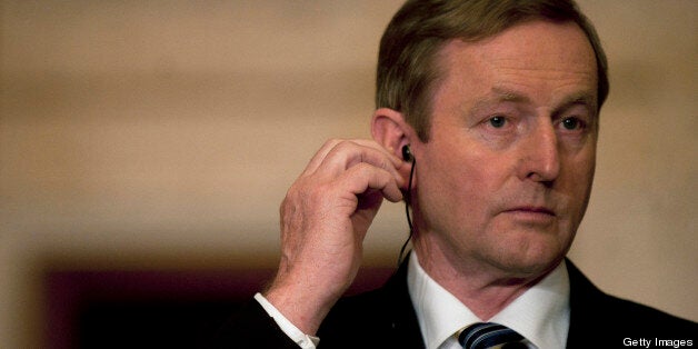 Irish Prime Minister Enda Kenny gestures during a joint press conference with his Spanish counterpart at the Alhambra in Granada on April 28, 2013. Spanish Prime Minister Mariano Rajoy met his Irish counterpart Enda Kenny, whose country currently heads the EU, to plead for stepped up European financial measures to end the crisis. AFP PHOTO/ JORGE GUERRERO (Photo credit should read Jorge Guerrero/AFP/Getty Images)