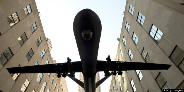 Members of Grandmothers Against the War, Granny Peace Brigade, the Raging Grannies and other groups hoist a model of a drone in the air as they protest the US military's use of drones during an 'April Days of Action' demonstration April 3, 2013 in New York. A few dozen people gathered on 5th Avenue for the protest. The imminent proliferation of unmanned aircraft in American skies has stirred a debate which veers between excitement at the possibilities to deep concern they may be deployed to snoop on law-abiding citizens. AFP PHOTO / Don Emmert (Photo credit should read DON EMMERT/AFP/Getty Images)