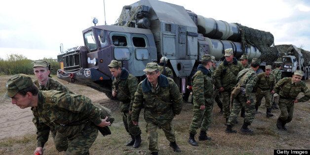 Picture taken on September 24, 2009 shows soldiers near an S-300 surface-to-air missile complex during the joint Russian-Belarussian military exercises 'West-2009' some 230km southwest of Minsk near the village of Volka. Russia has deployed sophisticated S-300 air defence missiles in Georgia's pro-Moscow rebel region of Abkhazia, the commander in chief of the air force said on August 11, 2010, news agencies reported. AFP PHOTO / VIKTOR DRACHEV (Photo credit should read VIKTOR DRACHEV/AFP/Getty Images)