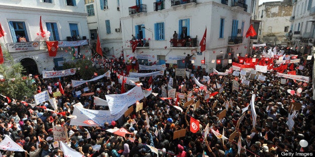 Tunisians protest outside the headquarters of the Union of Tunisian Workers during the May Day rally in Tunis on May 1, 2012.