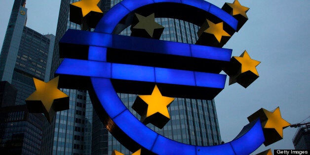 A euro sign sculpture stands outside the European Central Bank (ECB) headquarters in Frankfurt, Germany, on Tuesday, April 30, 2013. The ECB will cut its main refinancing rate 25 basis points to a record 0.5 percent on May 2, the median estimate from a Bloomberg survey of 66 economists shows, after gauges of business activity for April underscored weakness in the euro region. Photographer: Ralph Orlowski/Bloomberg via Getty Images