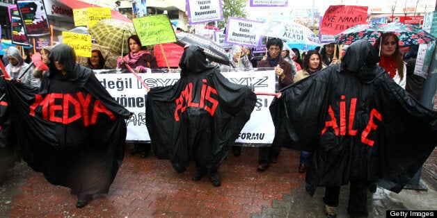 Turkish women and human rights activists attend a rally during the International Day for the Elimination of Violence against Women in Ankara on November 25, 2010. The protesters asked government to protect women against violence and discrimination and respect the basic human rights. AFP PHOTO/ADEM ALTAN (Photo credit should read ADEM ALTAN/AFP/Getty Images)