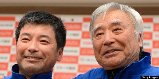 Japanese adventurer Yuichiro Miura (R) poses with his son Gota Miura (L) for photographers during a press conference in Tokyo on March 22, 2013. The eighty-year-old Japanese adventurer will leave Japan on March 28 to climb Mount Everest for the third time and become the oldest person to scale the world's highest peak. AFP PHOTO/Toru YAMANAKA (Photo credit should read TORU YAMANAKA/AFP/Getty Images)