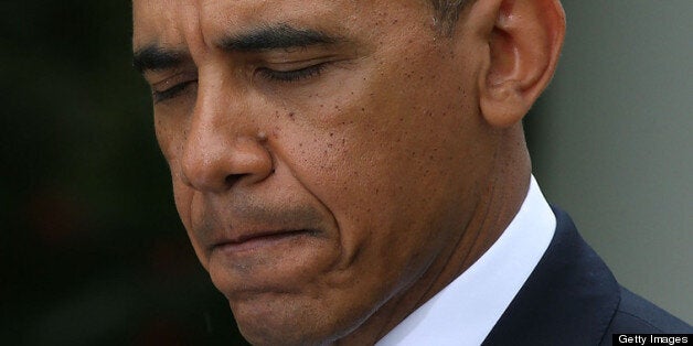 WASHINGTON, DC - MAY 16: U.S. President Barack Obama speaks in the rain during a news conference with Prime Minister Recep Tayyip Erdogan of Turkey (not shown), in the Rose Garden at the White House, May 16, 2013 in Washington, DC. President Obama answered questions on the IRS Justice Department invesigation and talked about the situation with Syria. (Photo by Mark Wilson/Getty Images)