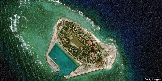 SOUTHWEST CAY, SPRATLY ISLANDS - FEBRUARY 27, 2013: Southwest Cay (also known as Pugad Island), is a small island controlled by Vietnam, is part of the Spratly Island chain in the hotly contested South China Sea. Southwest Cay was originally occupied by the Philippines?the country that occupies the majority of the Spratly Islands?but was taken by South Vietnam in the 1970s. Vietnam has since built a fortified inlet, an army garrison and a number of support buildings on the island, as seen on this image from February 27, 2013. (Photo DigitalGlobe via Getty Images)