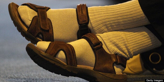 BIRMINGHAM, ENGLAND - SEPTEMBER 19: A man wearing socks and sandals listens as Deputy Prime Minister and leader of the Liberal Democrats Nick Clegg speaks during a Question and answer session at the Liberal Democrat Autumn Conference at the International Convention Centre (ICC) on September 19, 2011 in Birmingham, England. Mr Clegg anwered question on a range of topics including tuition fees, housing and youth employment. (Photo by Dan Kitwood/Getty Images)