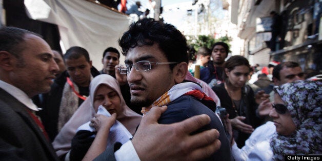 Google executive Wael Ghonim, who emerged as a leading voice in Egypt's uprising, reacts as he leaves the stage area after he