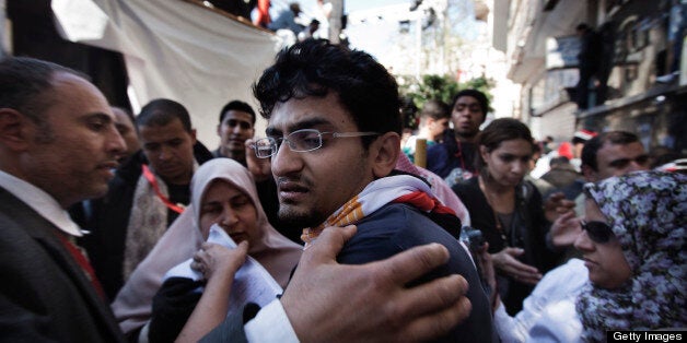 Google executive Wael Ghonim, who emerged as a leading voice in Egypt's uprising, reacts as he leaves the stage area after he was barred by security guards from standing on it, at Cairo's Tahrir Square on February 18, 2011 where hundreds of thousands of Egyptians massed to celebrate the fall of strongman Hosni Mubarak. AFP PHOTO/MARCO LONGARI (Photo credit should read MARCO LONGARI/AFP/Getty Images)