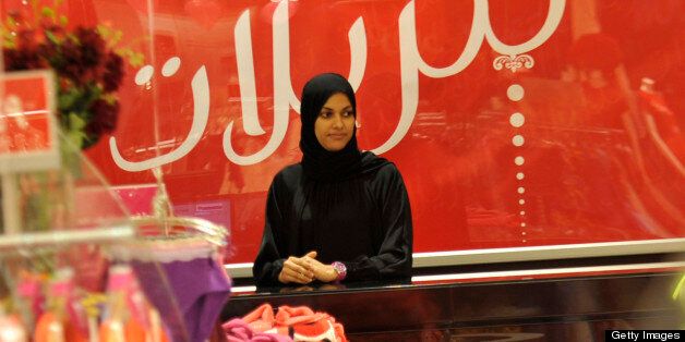 A Saudi saleswoman waits for customers at a lingerie shop for women and families only in the Saudi Red Sea port of Jeddah on January 2, 2012. From this week, only female staff will be able to sell women's lingerie in Saudi Arabia, ending decades of awkwardness in the ultra-conservative Muslim kingdom where women are expected to don black cloaks at all times out of the home. AFP PHOTO/AMER HILABI (Photo credit should read AMER HILABI/AFP/Getty Images)
