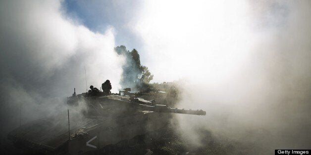 An Israeli army Merkava tanks maneuvers during a drill in the Israeli annexed Golan Heights near the border with Syria on May