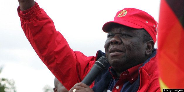 Movement for Democratic Change (MDC) President, Morgan Tsvangirai, gestures while speaking to supporters during a campaign meeting held at Zimbabwe Grounds, on May 19 2013, at the end of the three day MDC Policy Conference held in Harare. AFP PHOTO / JEKESAI NJIKIZANA (Photo credit should read JEKESAI NJIKIZANA/AFP/Getty Images)