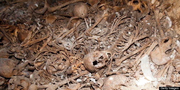 A picture taken on May 31, 2013 shows human skeletons in a mass grave that has been found at a cemetery in the Jaffa district of Tel Aviv, Israel. An official at the Muslim cemetery there told AFP that the grisly find occurred on May 29, 2013 when ground subsided as workers carried out renovations, revealing six chambers full of skeletons, thought to be the remains of dozens of Palestinians killed during the Israeli-Arab war of 1948, when the Jewish state was founded. Jaffa was at the time a Palestinian town but there was an exodus of most of its Arab population when it fell to the fledgling Israeli army and right-wing Jewish militias. AFP PHOTO/AHMAD GHARABLI (Photo credit should read AHMAD GHARABLI/AFP/Getty Images)