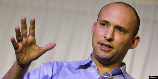 Naftali Bennett, leader of the HaBayit HaYehudi (Jewish Home), delivers a speech during a meeting at the Tel Aviv International Salon on December 23, 2012. A former high-tech entrepreneur, the 40-year-old is a former protege of Prime Minister Benjamin Netanyahu and is expected to lead his party to one of their best results ever in the upcoming election. AFP PHOTO / JACK GUEZ (Photo credit should read JACK GUEZ/AFP/Getty Images)