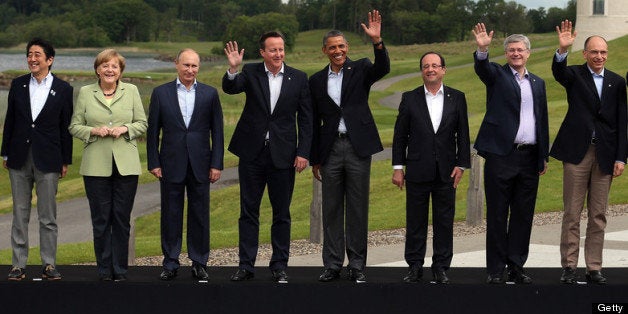 ENNISKILLEN, NORTHERN IRELAND - JUNE 18: (L-R) President of the European Commission Jose Manuel Barroso, Japanese Prime Minister Shinzo Abe, German Chancellor Angela Merkel, Russia's President Vladimir Putin, Britain's Prime Minister David Cameron, US President Barack Obama, French President Francois Hollande, Canadian Prime Minister Stephen Harper, Italian Prime Minister Enrico Letta and European Council President Herman Van Rumpuy, arrive for the 'family' group photograph at the G8 venue of Lough Erne on June 18, 2013 in Enniskillen, Northern Ireland. The two day G8 summit, hosted by UK Prime Minister David Cameron, is being held in Northern Ireland for the first time. Leaders from the G8 nations have gathered to discuss numerous topics with the situation in Syria expected to dominate the talks. (Photo by Matt Cardy/Getty Images)