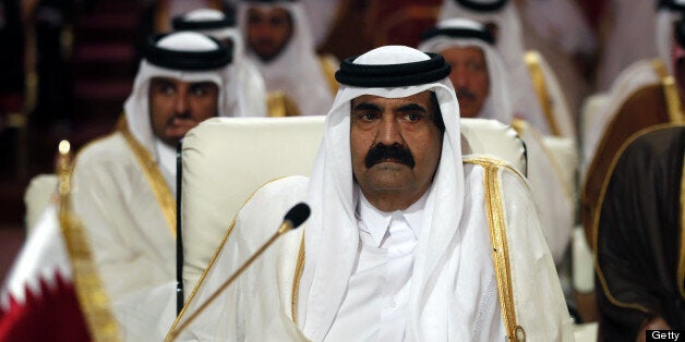 Qatar's Emir Hamad bin Khalifa al-Thani attends the opening of the Arab League summit in the Qatari capital Doha on March 26,