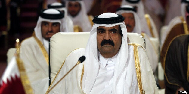 Qatar's Emir Hamad bin Khalifa al-Thani attends the opening of the Arab League summit in the Qatari capital Doha on March 26, 2013. The Arab League kicked off a two-day summit in Doha where opponents of President Bashar al-Assad will represent Syria for the first time, despite rifts which have marred their political gains. AFP PHOTO/KARIM SAHIB (Photo credit should read KARIM SAHIB/AFP/Getty Images)