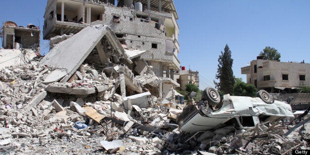 A picture shows destruction in Sbeneh, south of the Syrian capital Damascus, on June 16, 2013. More than 70 Syrian military officers have defected to the opposition and crossed into Turkey, an official there said, as world leaders prepared to discuss the Syrian conflict at the G8 summit. AFP PHOTO/WARD AL-KESWANI (Photo credit should read WARD AL-KESWANI/AFP/Getty Images)