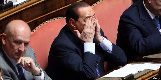 ROME, ITALY - APRIL 30: (L-R) Former Minister of the Culture Sandro Bondi, Silvio Berlusconi and former president of the Senate Renato Schifani attend the confidence vote at the Senate on April 30, 2013 in Rome, Italy. The new coalition government was formed through extensive cooperation agreements between the right and left coalitions after a two-month long post-election deadlock. (Photo by Franco Origlia/Getty Images)