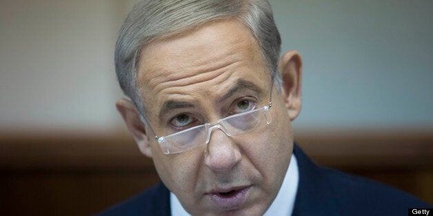 Israeli Prime Minister Benjamin Netanyahu attends the weekly cabinet meeting in his Jerusalem office, on July 14, 2013 . AFP PHOTO/ABIR SULTAN-POOL (Photo credit should read ABIR SULTAN/AFP/Getty Images)