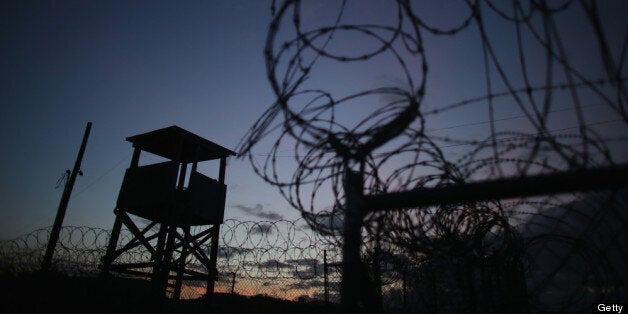 GUANTANAMO BAY, CUBA - JUNE 27: (EDITORS NOTE: Image has been reviewed by the U.S. Military prior to transmission.) A watch tower is seen in the currently closed Camp X-Ray which was the first detention facility to hold 'enemy combatants' at the U.S. Naval Station on June 27, 2013 in Guantanamo Bay, Cuba.The U.S. Naval Station at Guantanamo Bay, houses the American detention center for 'enemy combatants'. President Barack Obama has recently spoken again about closing the prison which has been used to hold prisoners from the invasion of Afghanistan and the war on terror since early 2002. (Photo by Joe Raedle/Getty Images)