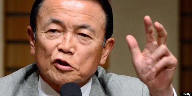 Japan's Finance and Deputy Prime Minister Taro Aso gestures as he delivers a speech in Tokyo on June 28, 2013. Aso's speech was entitled 'Abenomics and the future of Japan's economy'. AFP PHOTO/Toru YAMANAKA (Photo credit should read TORU YAMANAKA/AFP/Getty Images)