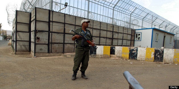 A Yemeni security officer stands guard outside the French embassy building in the capital Sanaa on April 24, 2013. The embass