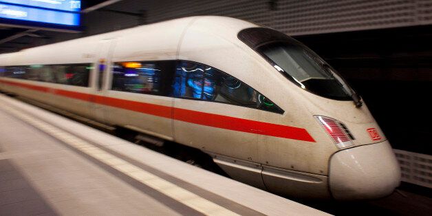 An InterCity Express (ICE) train, operated by Deutsche Bahn AG, arrives at Berlin Central Station, also known as Hauptbahnhof, in Berlin, Germany, on Tuesday, Aug. 13, 2013. German gross domestic product rose 0.7 percent from the first quarter and the French economy expanded 0.5 percent, the countries' national statistics offices said today. Photographer: Krisztian Bocsi/Bloomberg via Getty Images