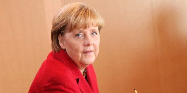 BERLIN, GERMANY - AUGUST 28: German Chancellor Angela Merkel arrives for the weekly German federal Cabinet meeting on August 28, 2013 in Berlin, Germany. High on the morning's agenda was discussion of new policies towards managing insolvency. (Photo by Adam Berry/Getty Images)